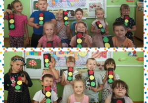 Dzieci pozują do zdjecia z sygnalizatorami
