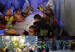 Warsztaty w Krainie Lodu. Dzieci siedzą przy długim stole i tworzą medale.