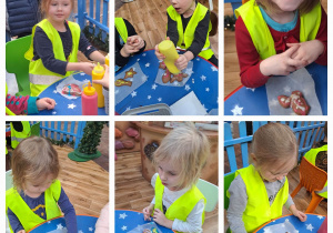 Dzieci ozdabiają wypieczone pierniki kolorowymi lukrami