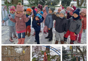 Grupa dzieci stoi na zaśnieżonym tarasie i wskazuje na drzewo na którym wisi karmnik dla ptaków