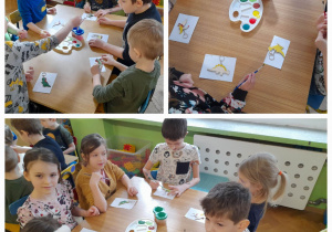 Dzieci siedzą przy stolikach i malują farbami breloczki w kształcie dinozaurów