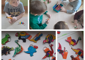 Dzieci siedzą przy stole i malują sklejkowe dinozaury / efekt pracy dzieci