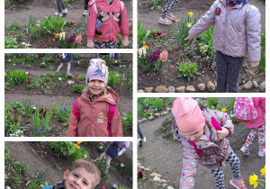 Dzieci pozują do zdjęcia w ogrodzie pełnym wiosennych kwiatów
