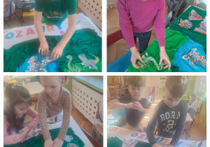 Dzieci przykleją pokolorowane obrazki do planszy o dinozaurach